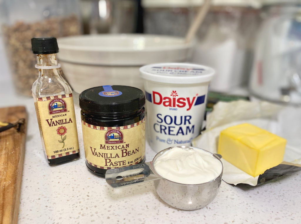 Vanilla bean paste, sour cream, and butter on the counter. [decadent banana bread]