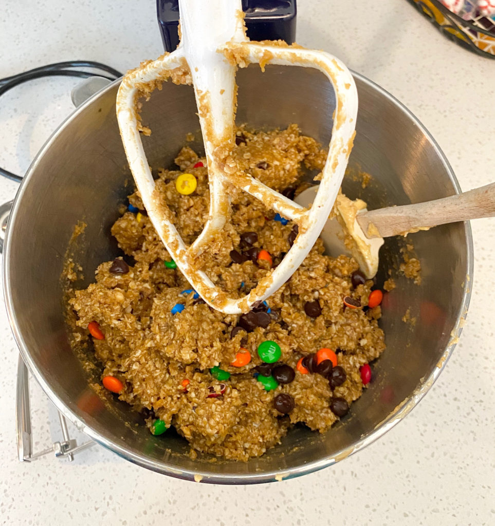 A mixer bowl with monster cookie dough inside [Monster Cookies]