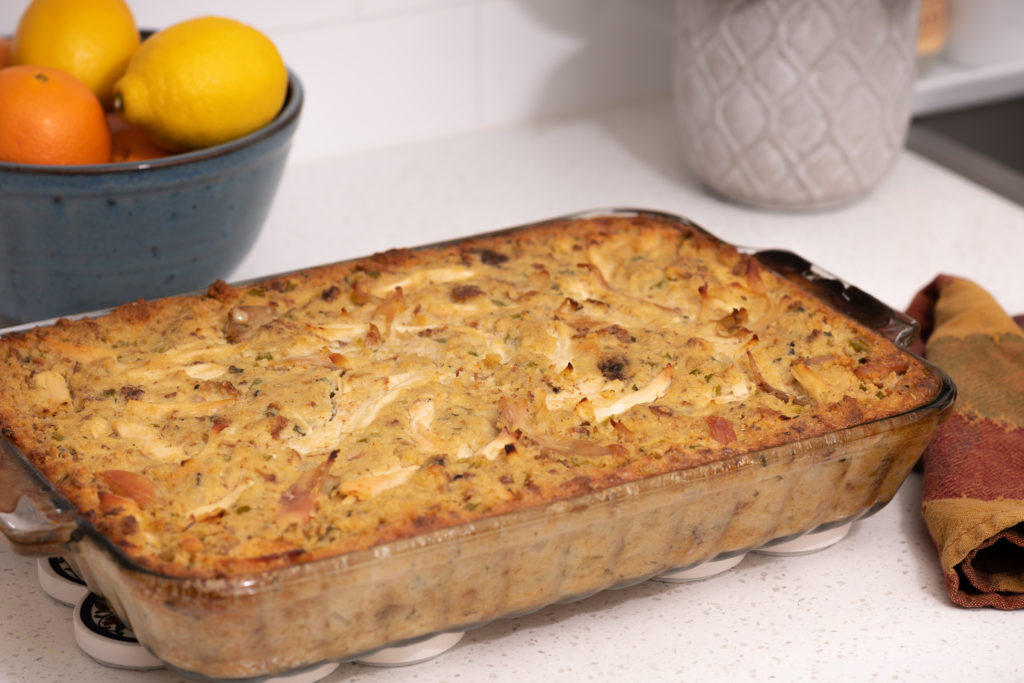 A 13x9 pan of Chicken and Dressing on a counter. [Chicken and Dressing]