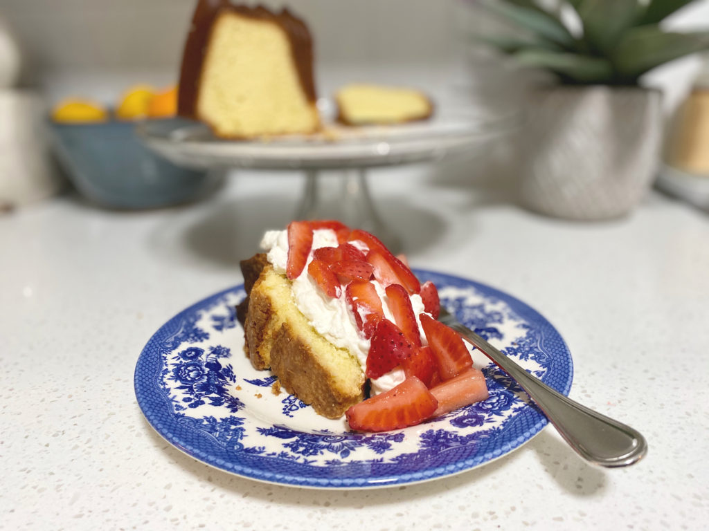 A slice of strawberry shortcake on a blue plate. [Strawberry Shortcake]