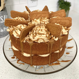 biscoff cake with biscoff buttercream, decorated with biscoff cookies on top. [biscoff cake]