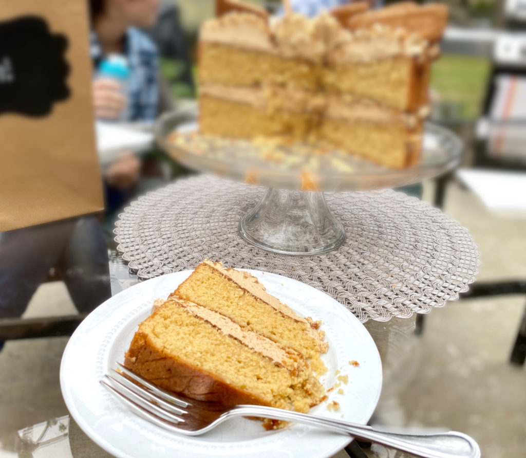 A slice of biscoff layer cake on a plate. [biscoff cake]