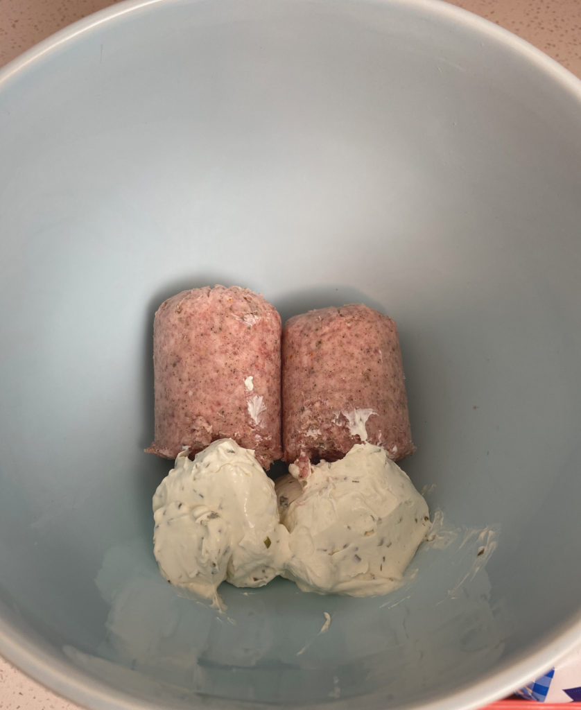 Sausage and cream cheese in mixing bowl