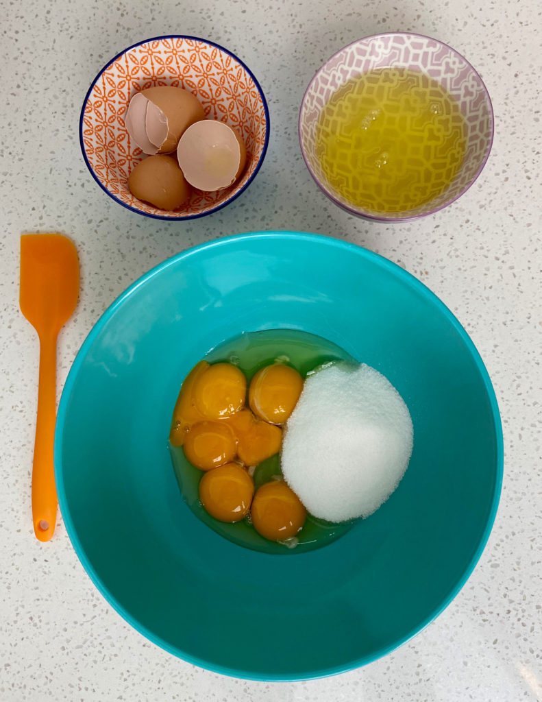 Eggs and sugar in mixing bowl