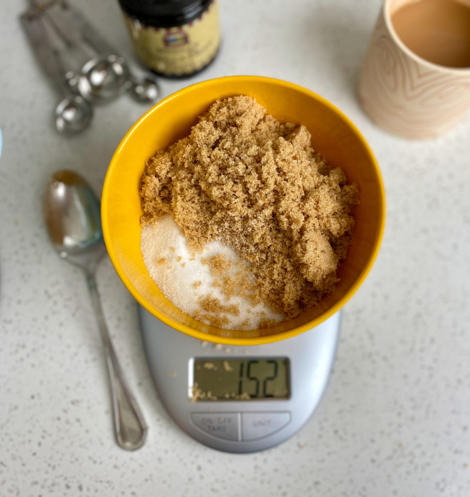 Weighing sugar for chocolate chip cookie recipe