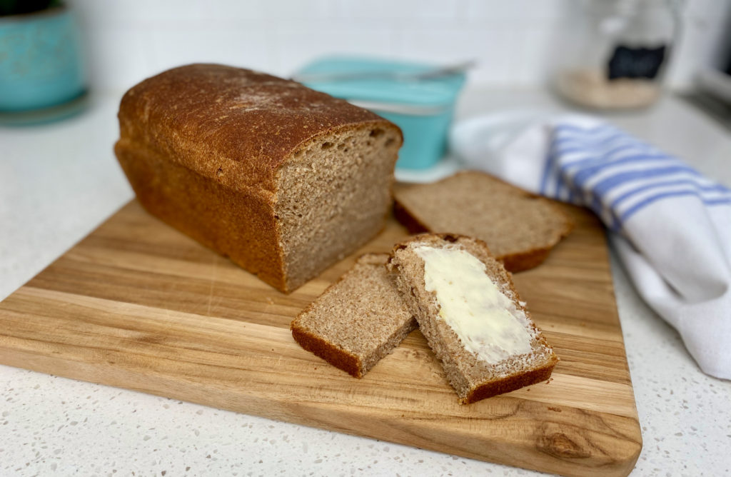 Sliced honey whole wheat bread with butter