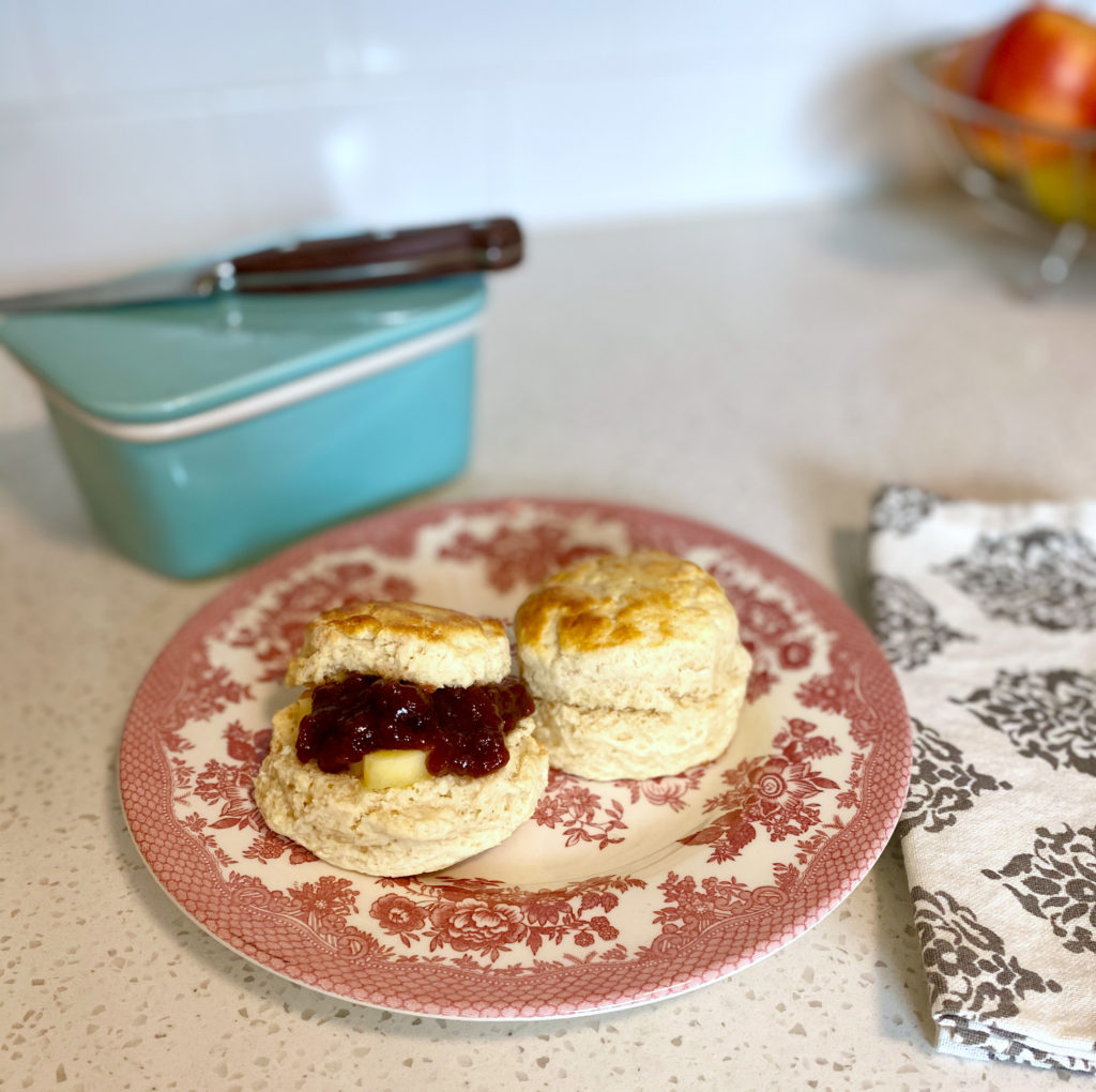 Classic British scones on a plate with butter and jam