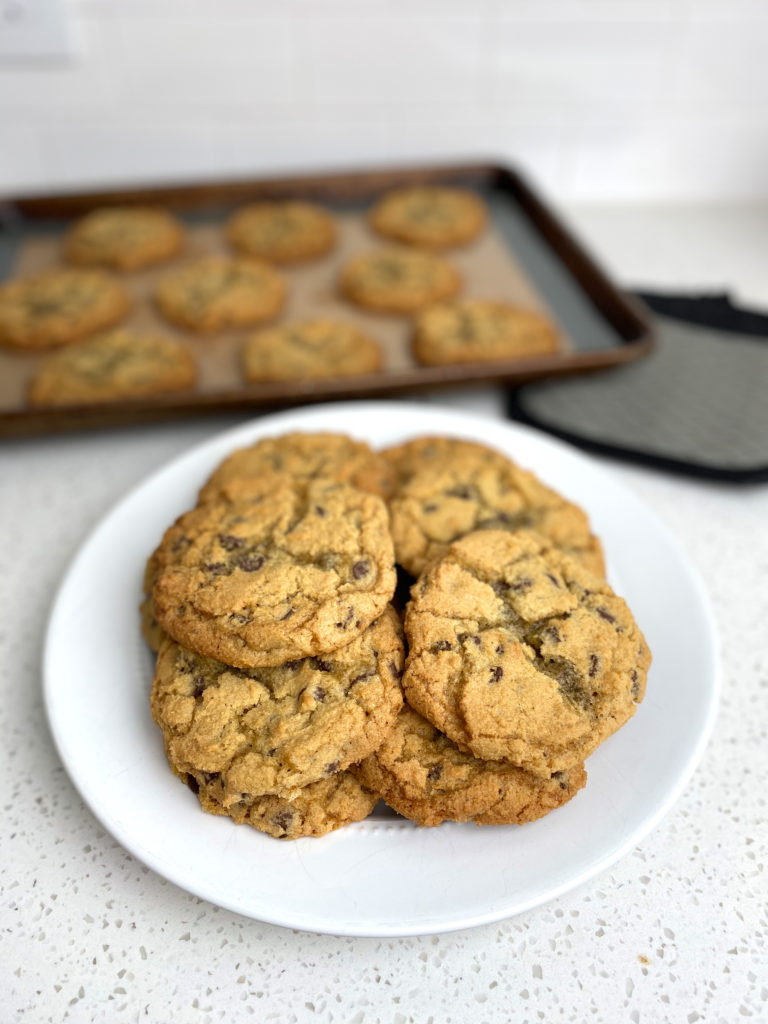 A plate of chewy Bailey's Irish Cream chocolate chip cookies on a counter